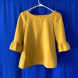 Beautiful citrine yellow top with ruffled sleeves and boatneck detail